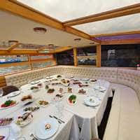 Белый диван у банкетного стола на теплоходе Галактика